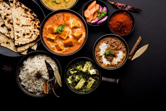 Punjabi spread — paneer butter masala, dal makhani, saag paneer, rice and roti